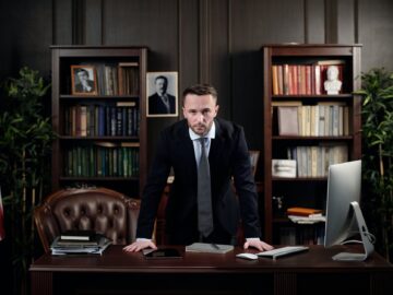 businessman in his office looking at the camera